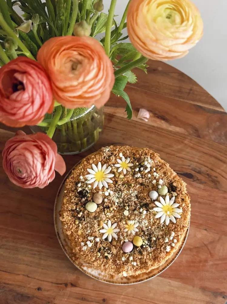 Easter Napoleon decorated with mini eggs and spring toppings
