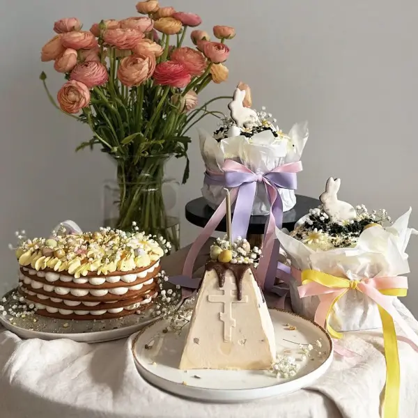 Easter Pastries – decorated eggs and baking sprinkles on rustic background