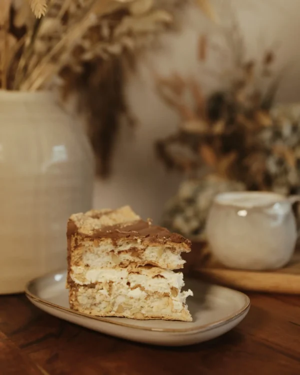 Slice of Kyiv Cake with nutty meringue and buttercream