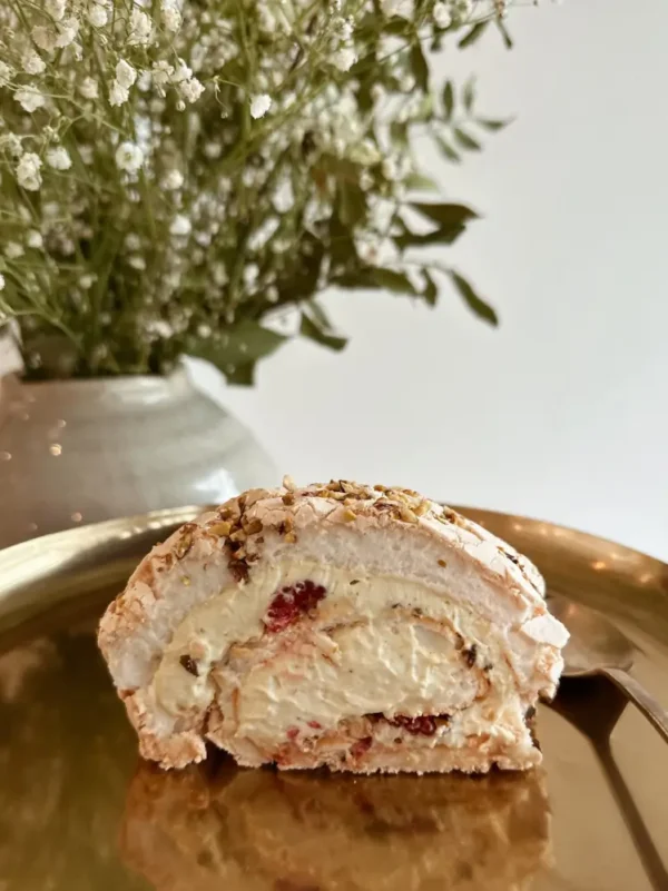 Inside texture of Meringue Roll with cream cheese and berries