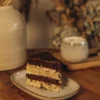 Slice of Smetannik cake with cocoa and sour cream