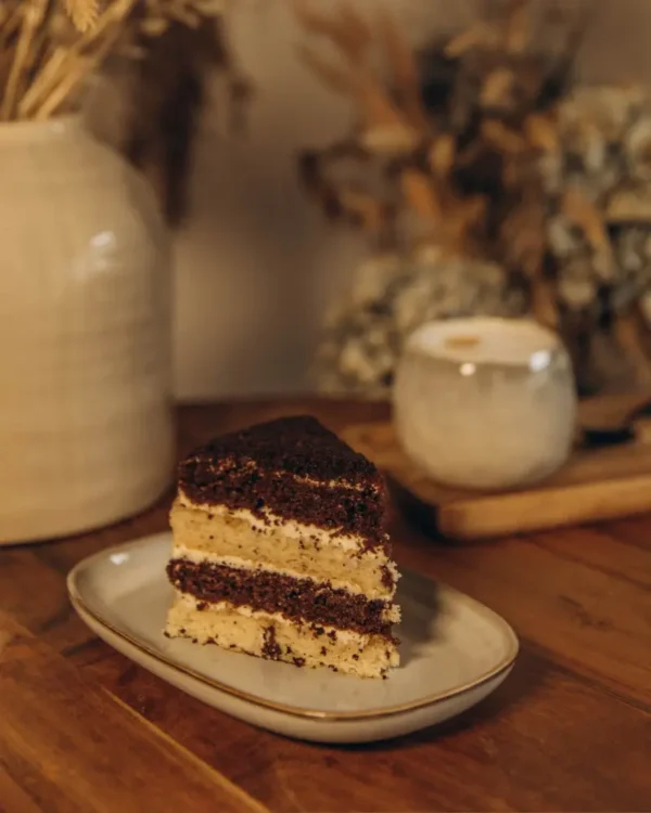 Slice of Smetannik cake with cocoa and sour cream