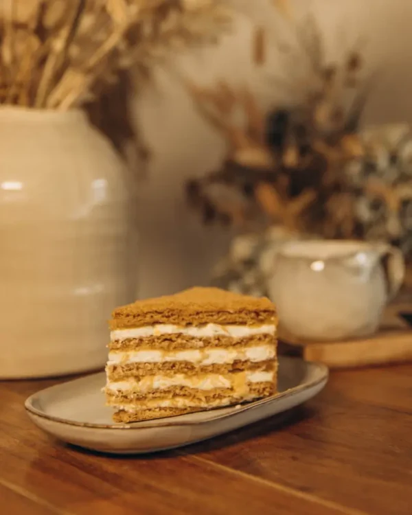 Slice of Honey Cake Orange with orange curd and cream